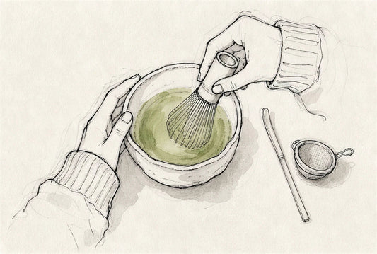 Whisking matcha with a bamboo whisk, seen from above