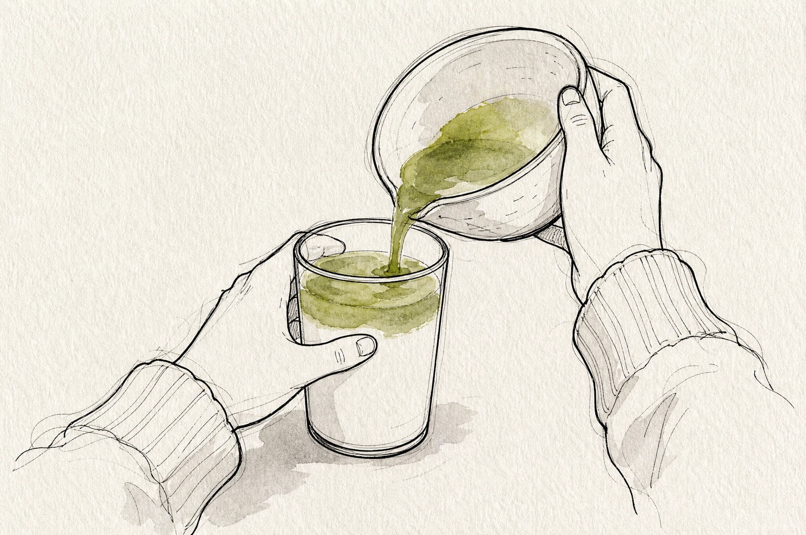 Matcha poured over warm oat milk in a glass