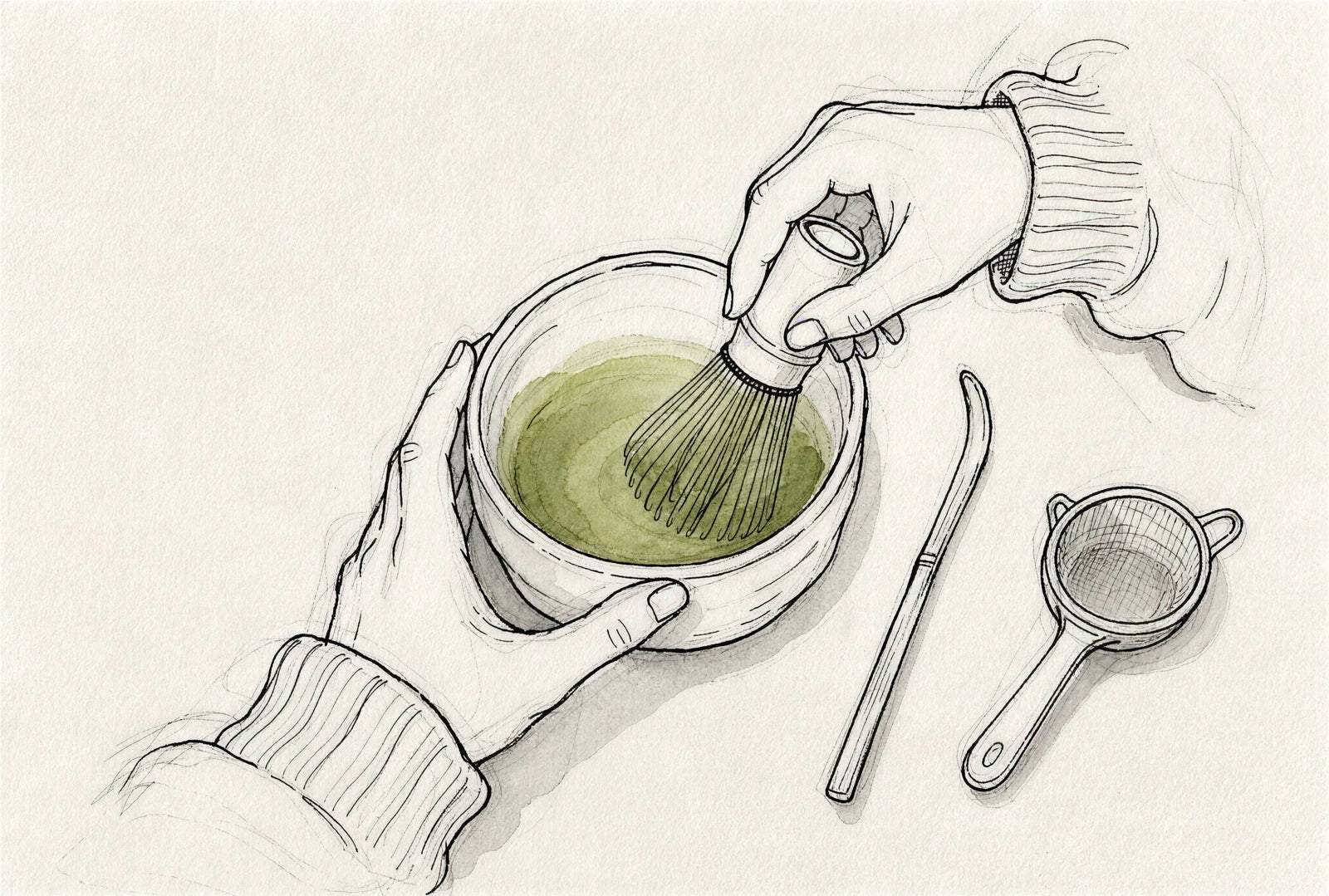 Matcha wird mit dem Bambusbesen in der Schale aufgeschlagen